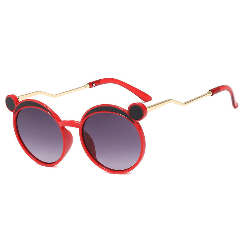 Damen Fashion-Runde Sonnenbrille mit innovativem Rahmen und farbigen Gläsern Karnz