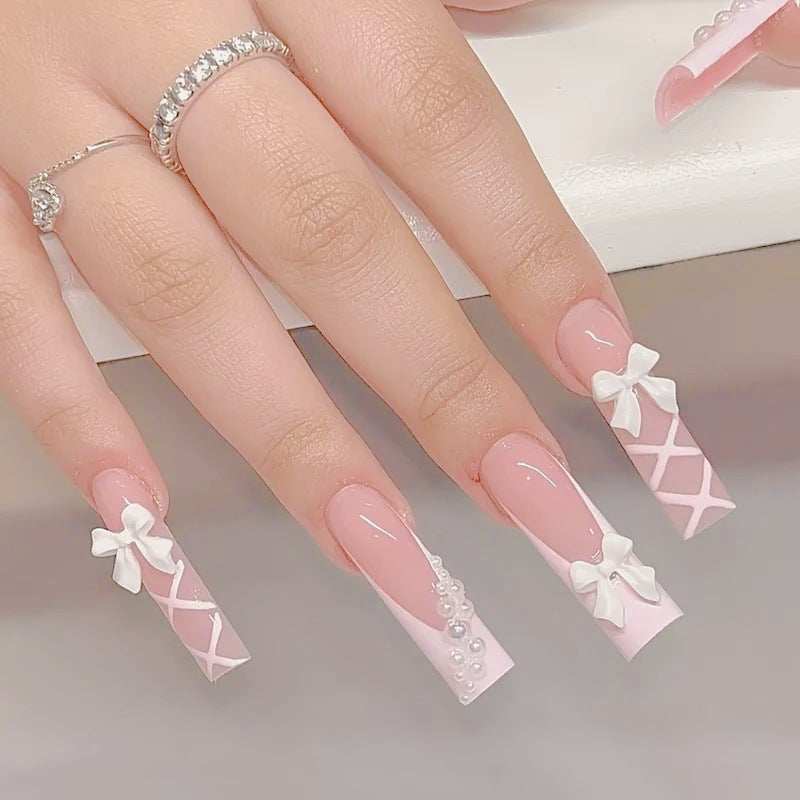 Kunstnagelset mit eleganten 3D- Schleifen und Perlenverzierungen Karnz