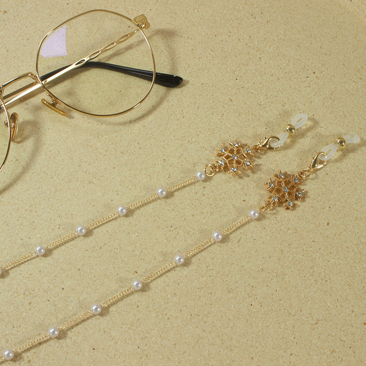 Elegante Brillenhalterkette mit Perlen und Schneeflockenanhänger Karnz