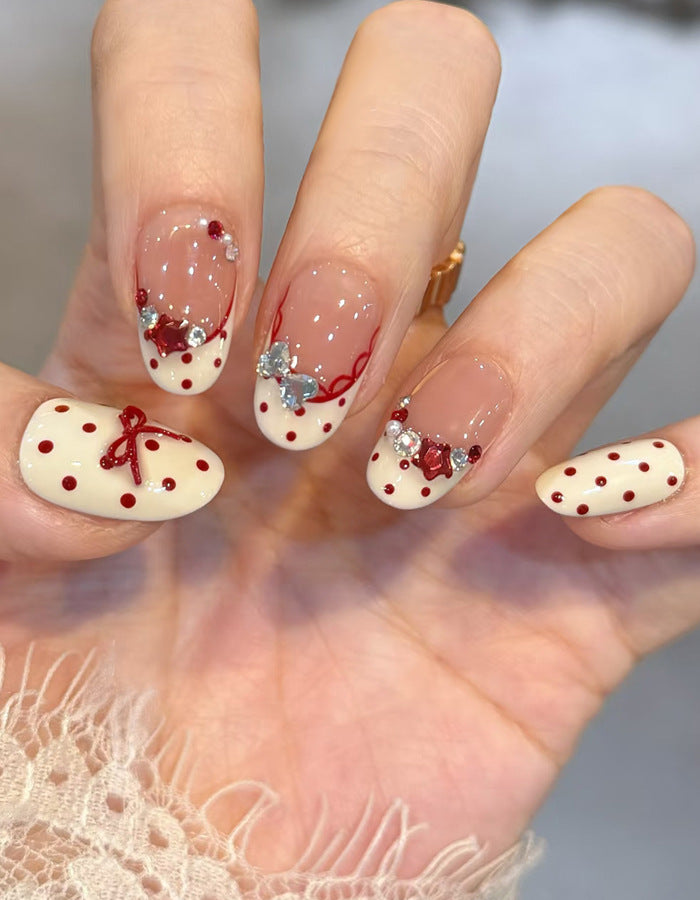 Künstlerisches Press-On Nagelset mit Schleife und floralen Details Karnz 1789389376