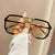 Damen geometrische Sonnenbrille mit besonderem Rahmen und UV-Schutz Karnz