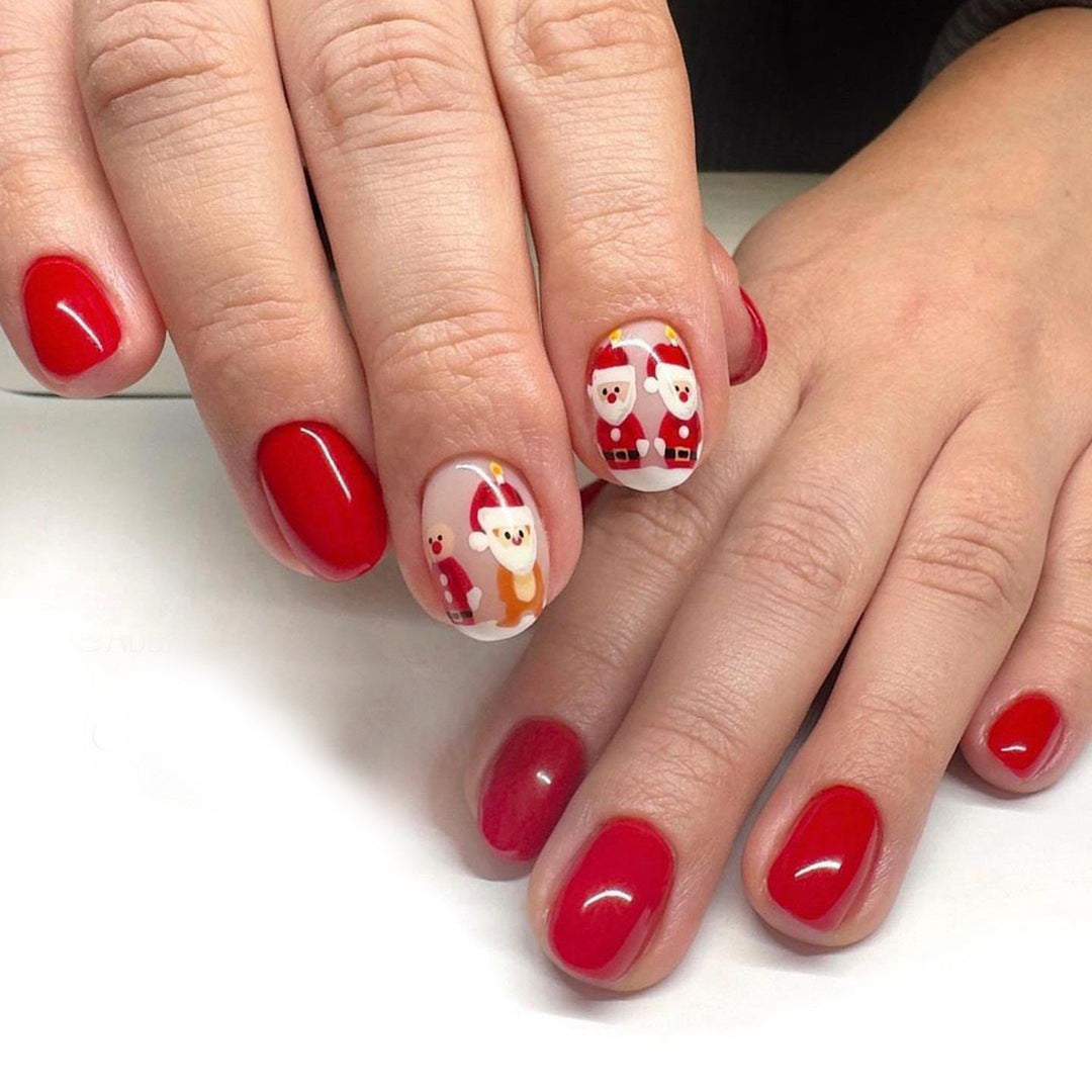 Kunstnagelset im festlichen Weihnachtsdesign mit niedlichen Motiven Karnz