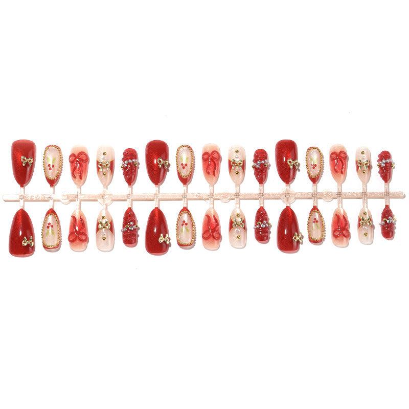 Kunstnagelset mit glamourösen Schleifen und funkelnden Details Karnz
