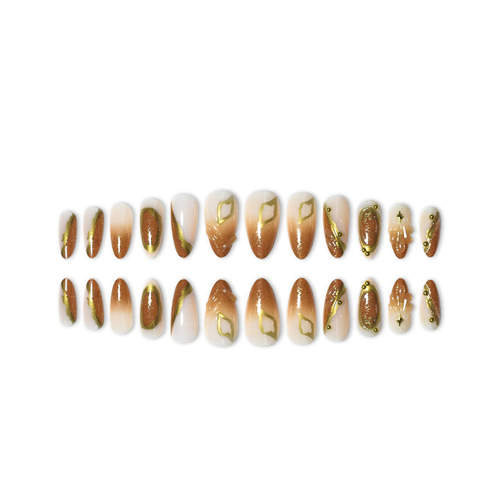 Luxuriöses Press-On-Nagelset mit kunstvollen goldenen Details Karnz