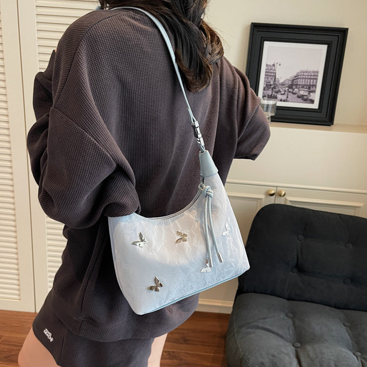 Stylische Handtasche mit Schmetterlingsdetail Karnz