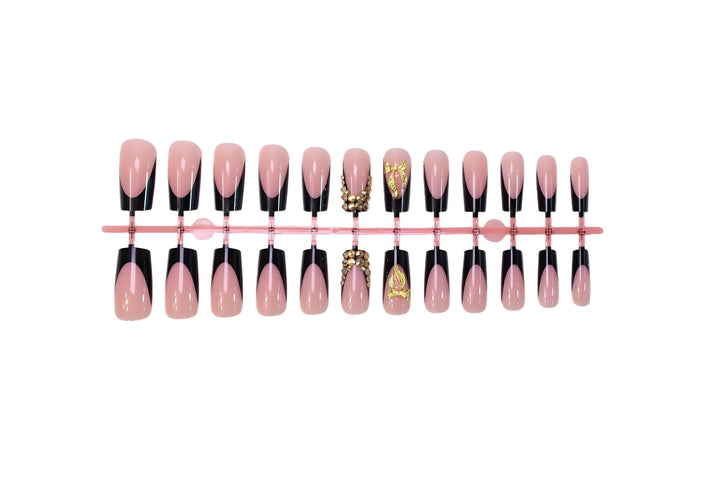 Kunstnagelset mit eleganter Goldverzierung und stilvollem Schwarz Karnz