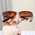 Damen Sonnenbrille mit großen, eleganten Gläsern und einem modernen Metallrahmen Karnz