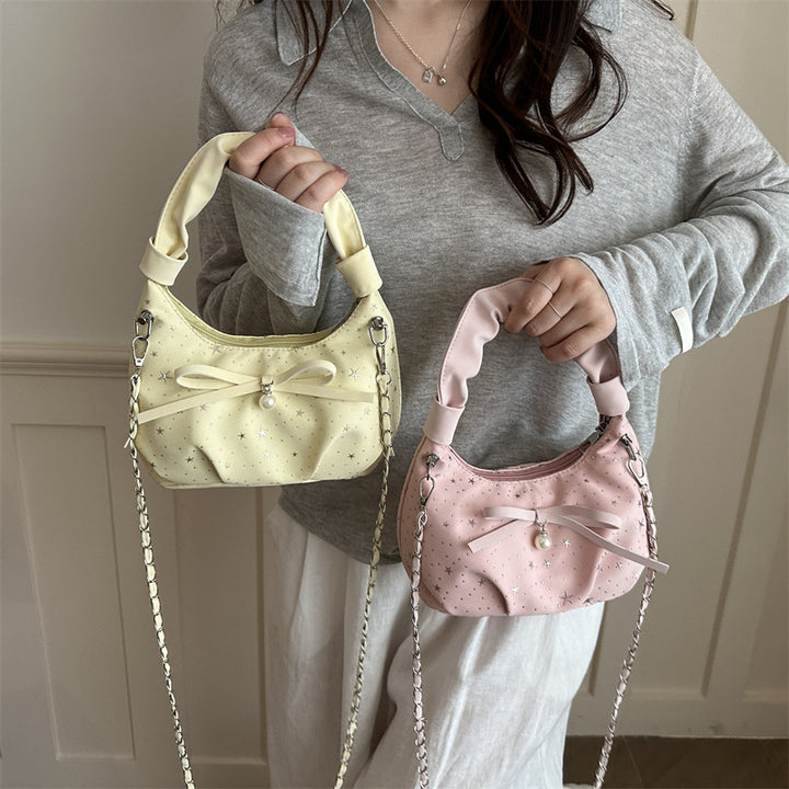 Elegante Handtasche mit Schleifendetail und Sternenprint