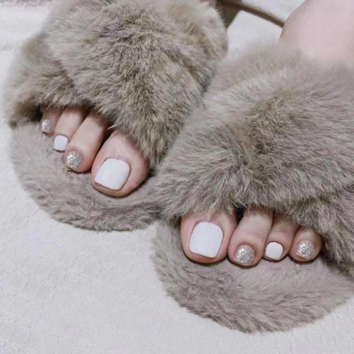 Glitzernde French Tip Zehennagelkunst