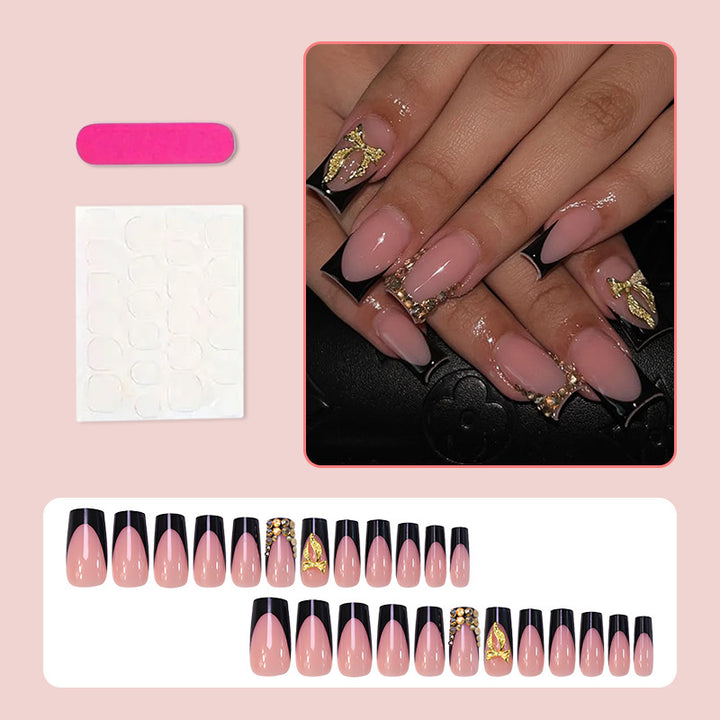 Kunstnagelset mit eleganter Goldverzierung und stilvollem Schwarz Karnz