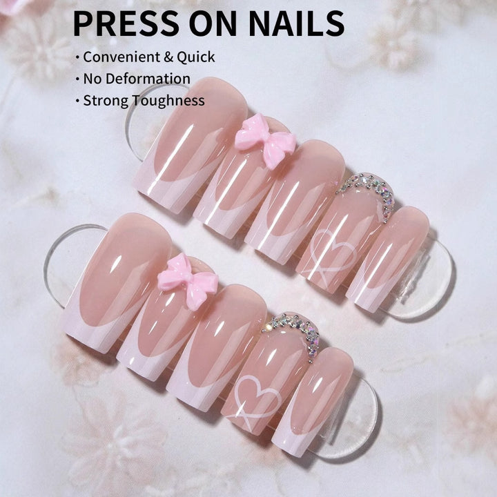 Kunstnagelset mit eleganten Schleifen- und Glitzerverzierungen Karnz