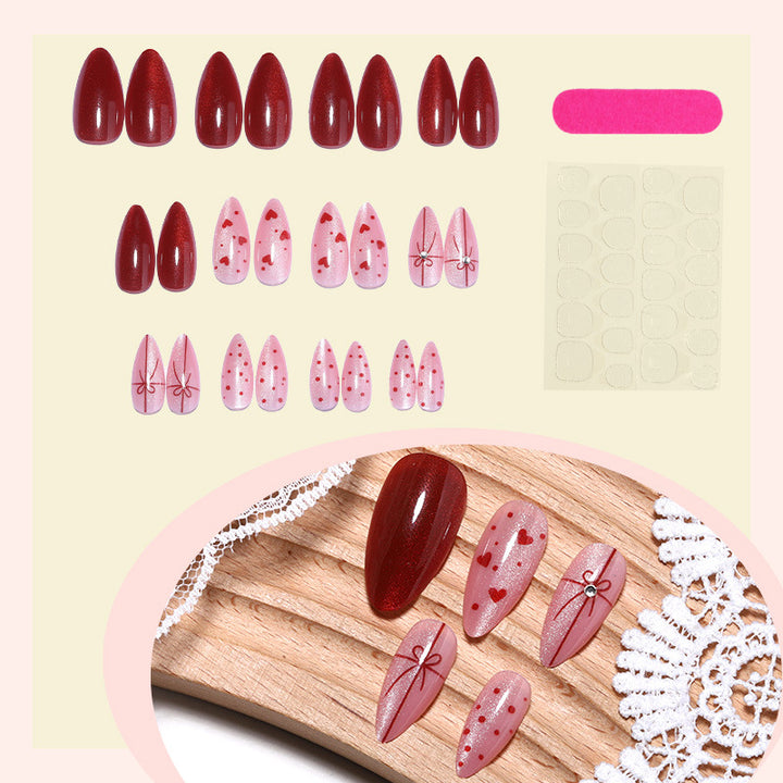 Dekoratives Press-On Nagelset mit Herz- und Schleifendesigns Karnz