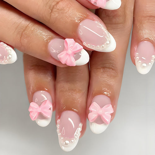 Kunstnagelset mit eleganten Schleifen- und Perlenverzierungen Karnz