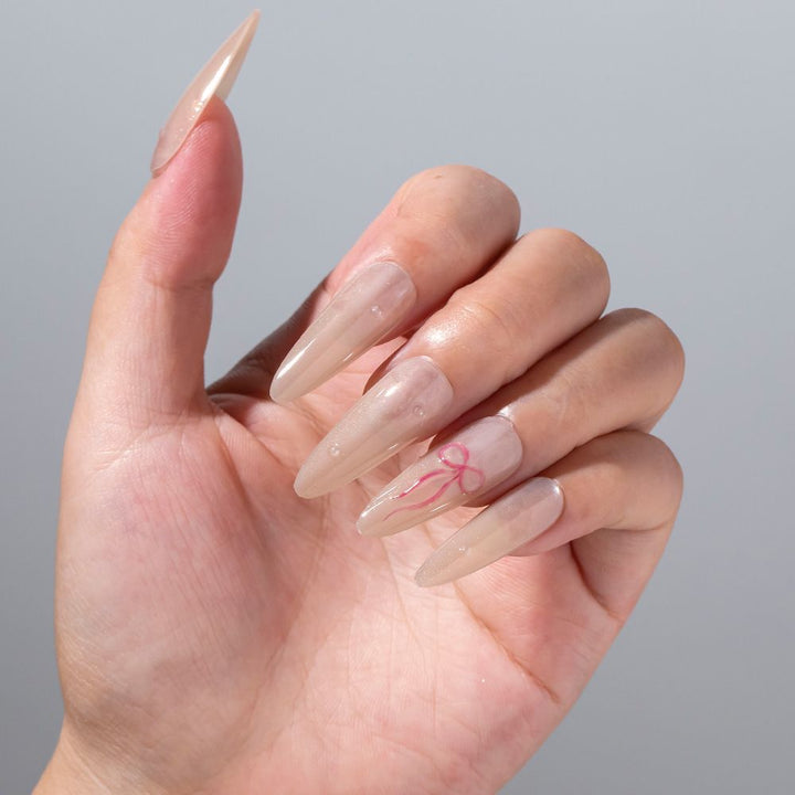 Elegantes Stiletto Press-On Nagelset mit Schleifenakzenten Karnz
