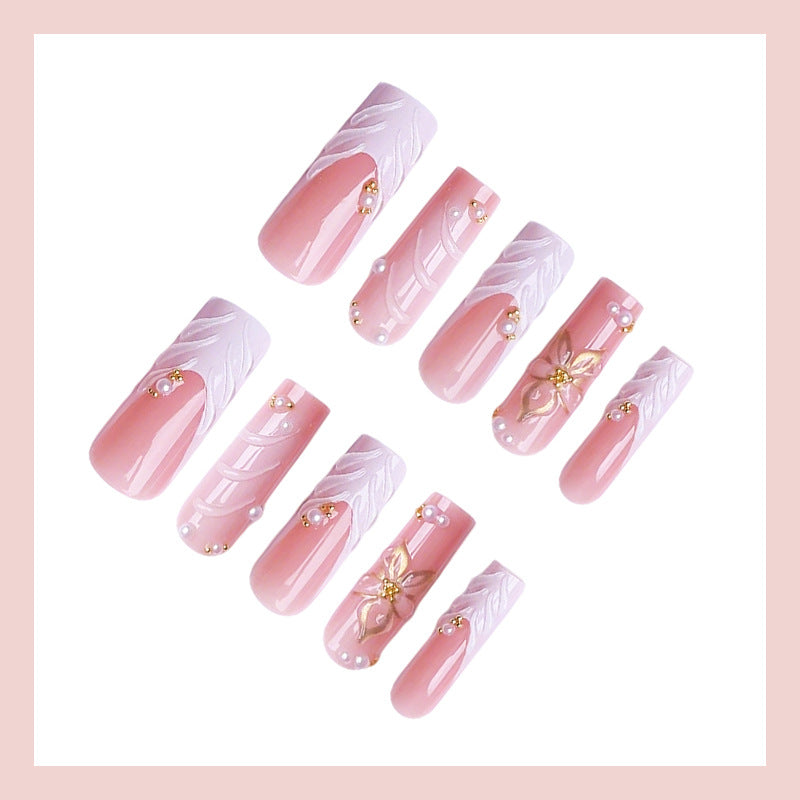 Kunstnagelset mit eleganten Blumendesigns Karnz