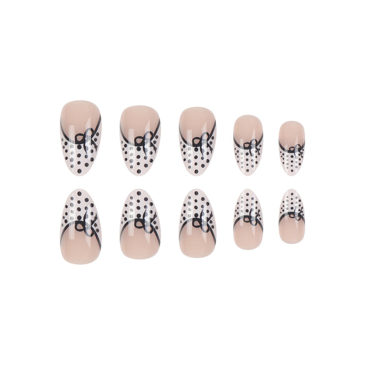 Elegante Stiletto Press-On Nägel mit Polka-Dot-Design und Schleifenakzenten Karnz