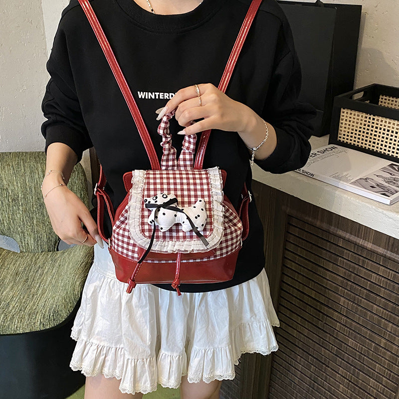 Verspielter Rucksack mit Karomuster und Tierapplikation Karnz