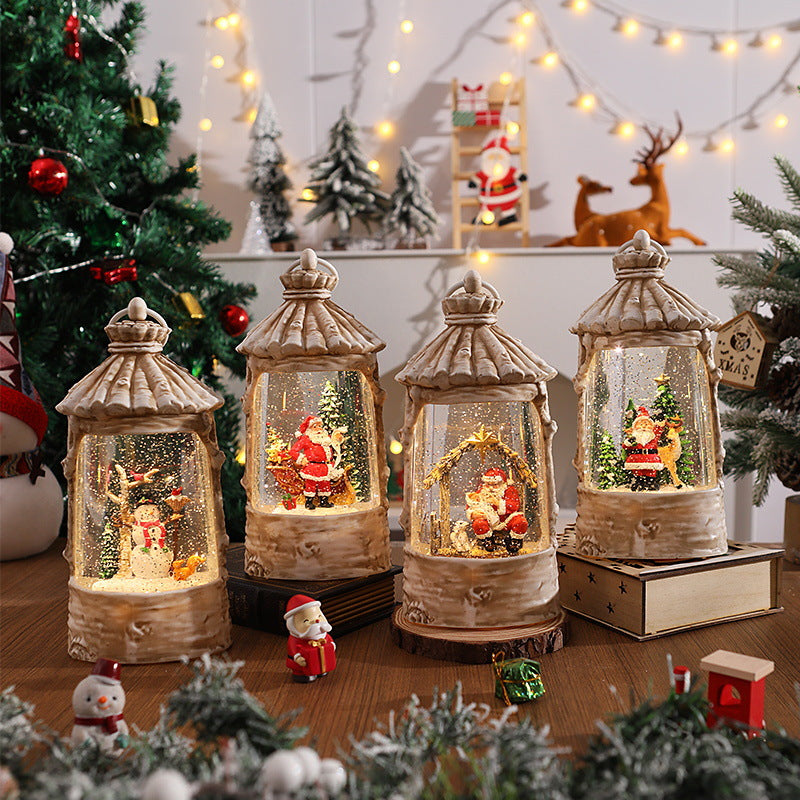 Beleuchtete Weihnachtslaterne mit Schneeszenen Karnz