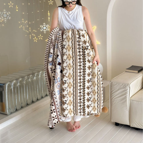Große kuschelige Wohndecke im Nordic-Boho-Muster mit Pompon-Quasten