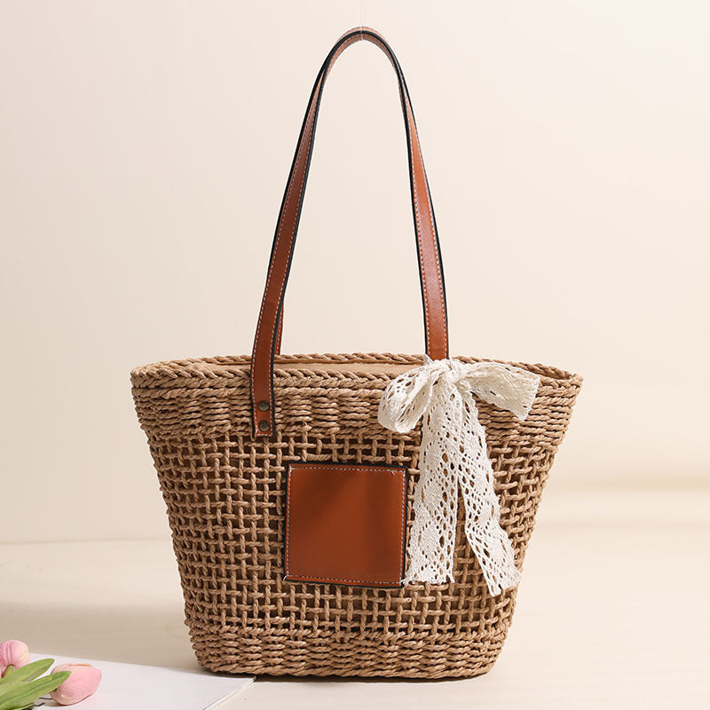 Damen Korbtasche mit eleganten Lederdetails und verspieltem Schleifenakzent Karnz