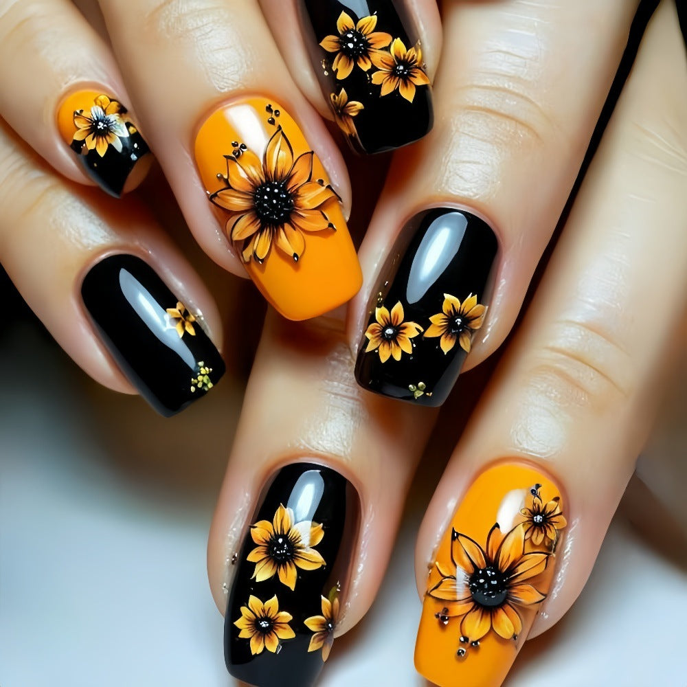 Kunstnägel im floralen Design mit Sonnenblumenmotiv Karnz