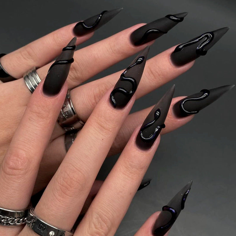 Künstlerisches Stiletto-Nageldesign Karnz