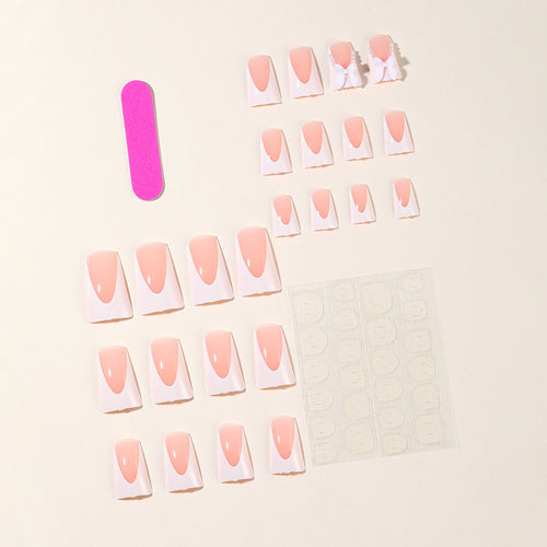 Elegante Stiletto-Nagelkunstverlängerungen mit Schleifenakzenten Karnz