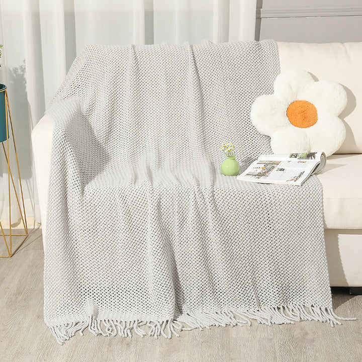 Strukturierte Strickwurfdecke