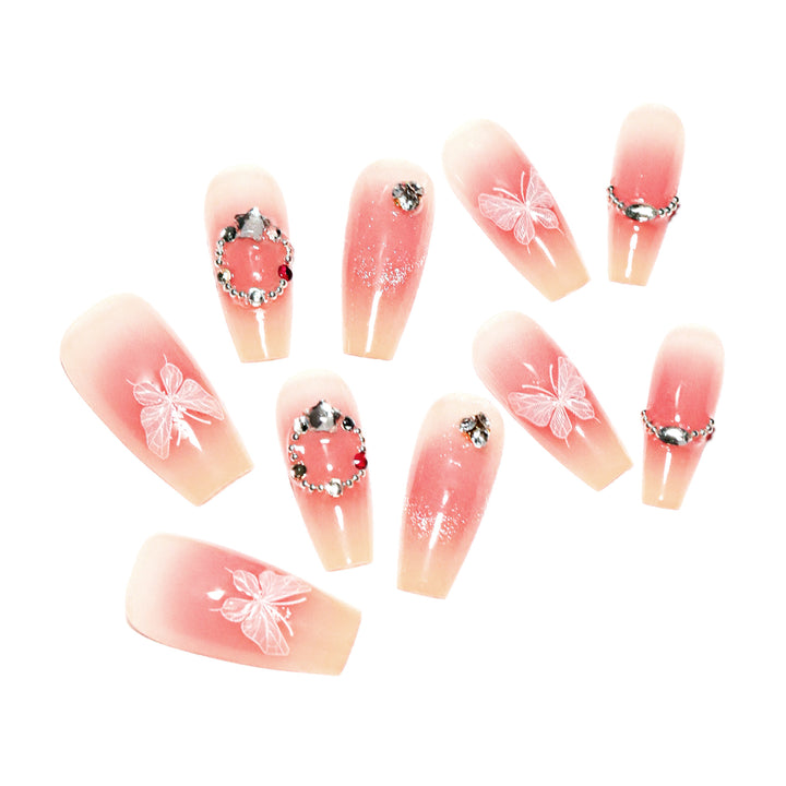 Künstliche Nagelverlängerungen mit floralem Design und funkelnden Akzenten Karnz