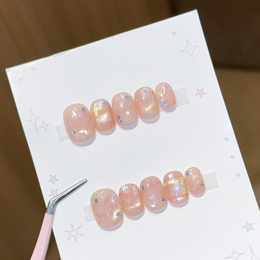 Glamouröse Kunstnagelspitzen mit Sternen Design Karnz