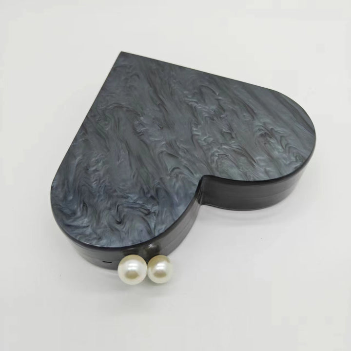 Künstlerische herzförmige Clutch