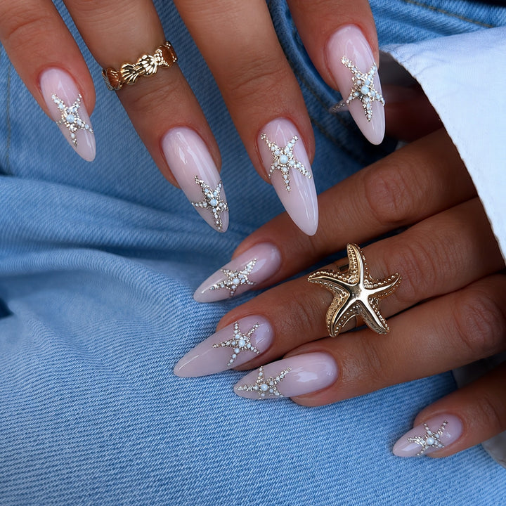 Kunstnagelset mit eleganten Stern-Motiven Karnz