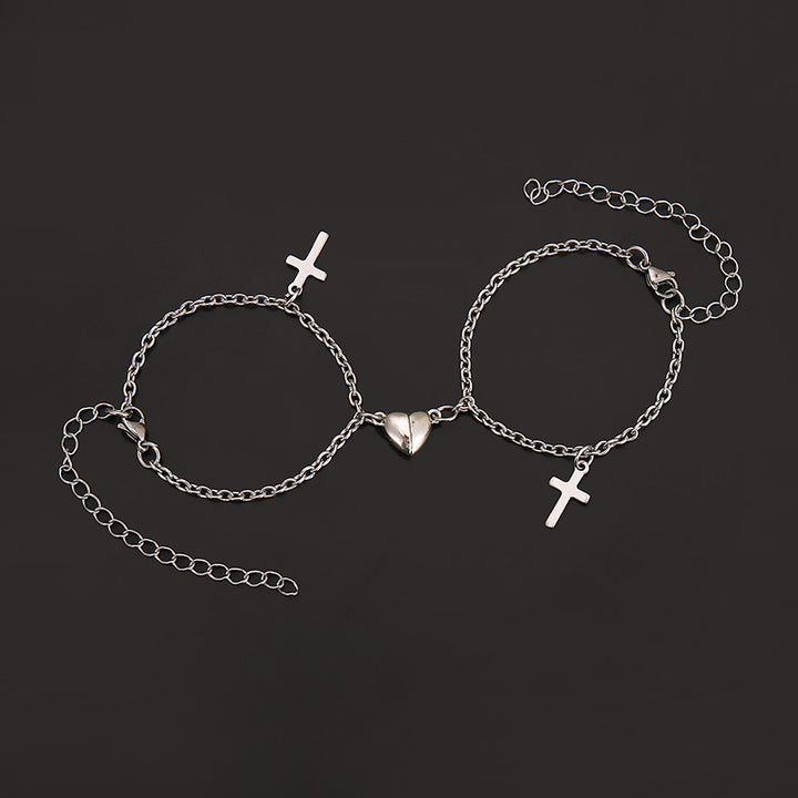 Versatile Armreif mit Kreuz- und Herzanhängern Karnz