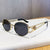 Damen elegante Sonnenbrille mit luxuriösem Rahmen und filigranem Design Karnz
