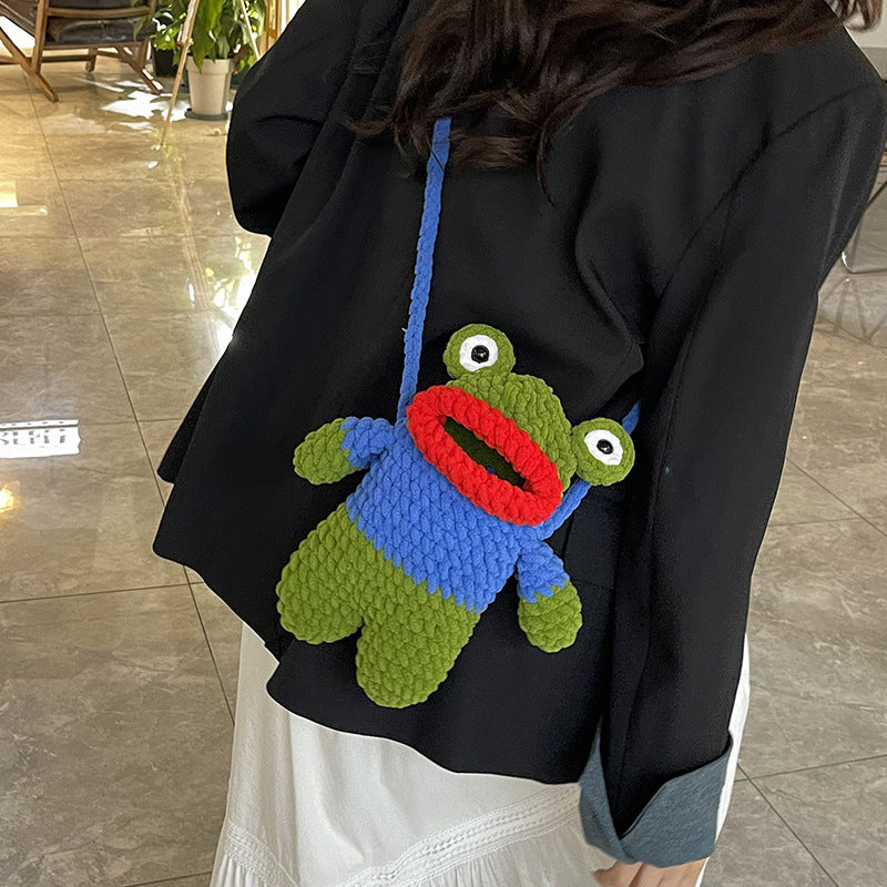 Süßer froschförmiger gehäkelter Mini-Rucksack