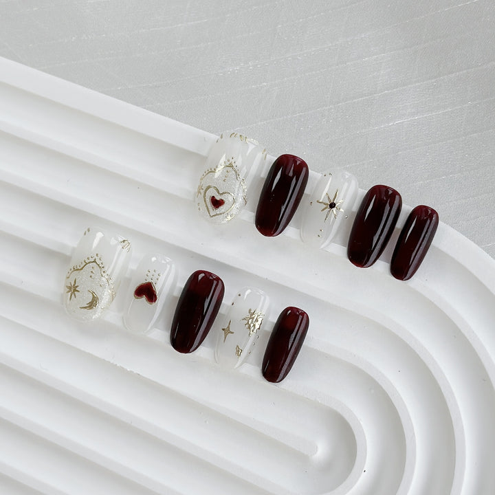 Künstlerisches Press-On Nagelkunstset mit Herz- und himmlischen Designs