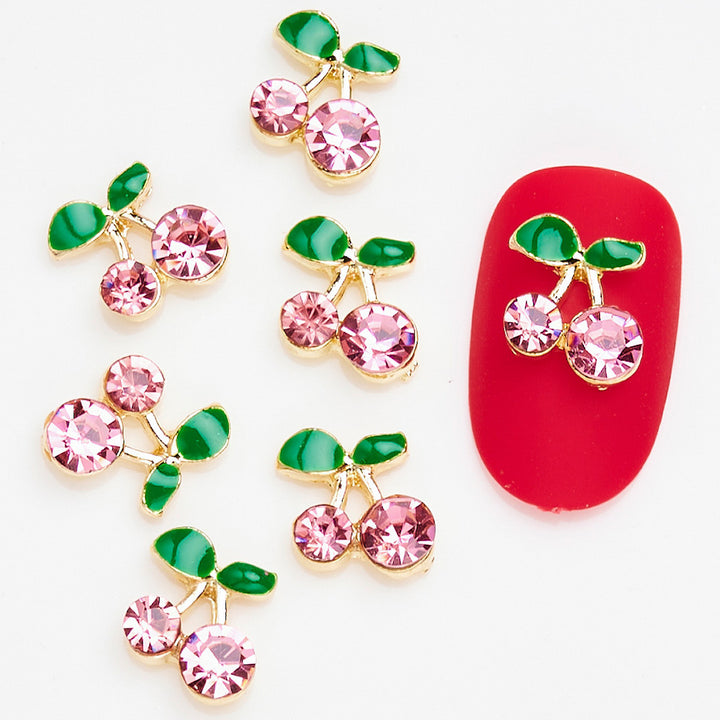 Dekorative Kirsch-Nagelkunst Charms