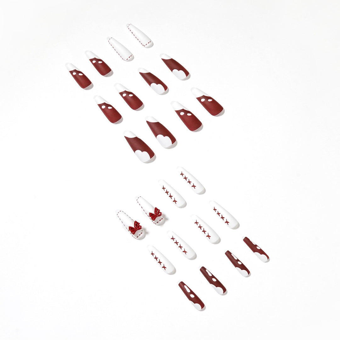 Kunstvolle Stiletto-Nägel mit Schleifen- und Zickzackdesign Karnz