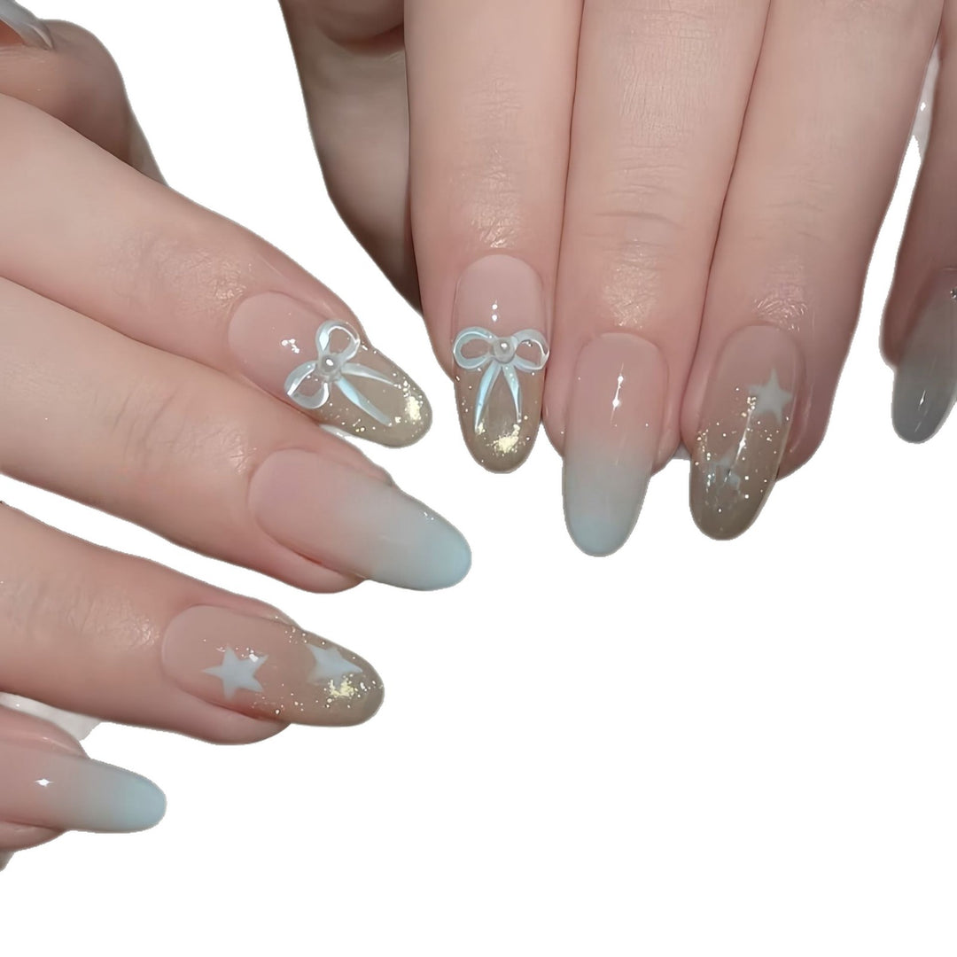 Elegante Kunstnagelset mit Schleifen- und Sternendesigns Karnz