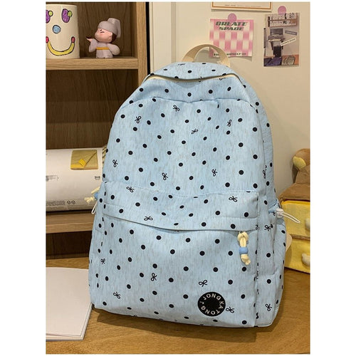 Verspielt gepunkteter Rucksack