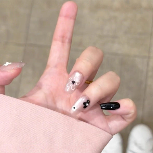 Künstlerisches Press-On Nagelset mit floralem und gesprenkelt Design Karnz