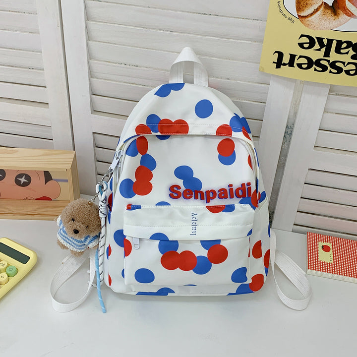 Verspielt gepunkteter Mini-Rucksack
