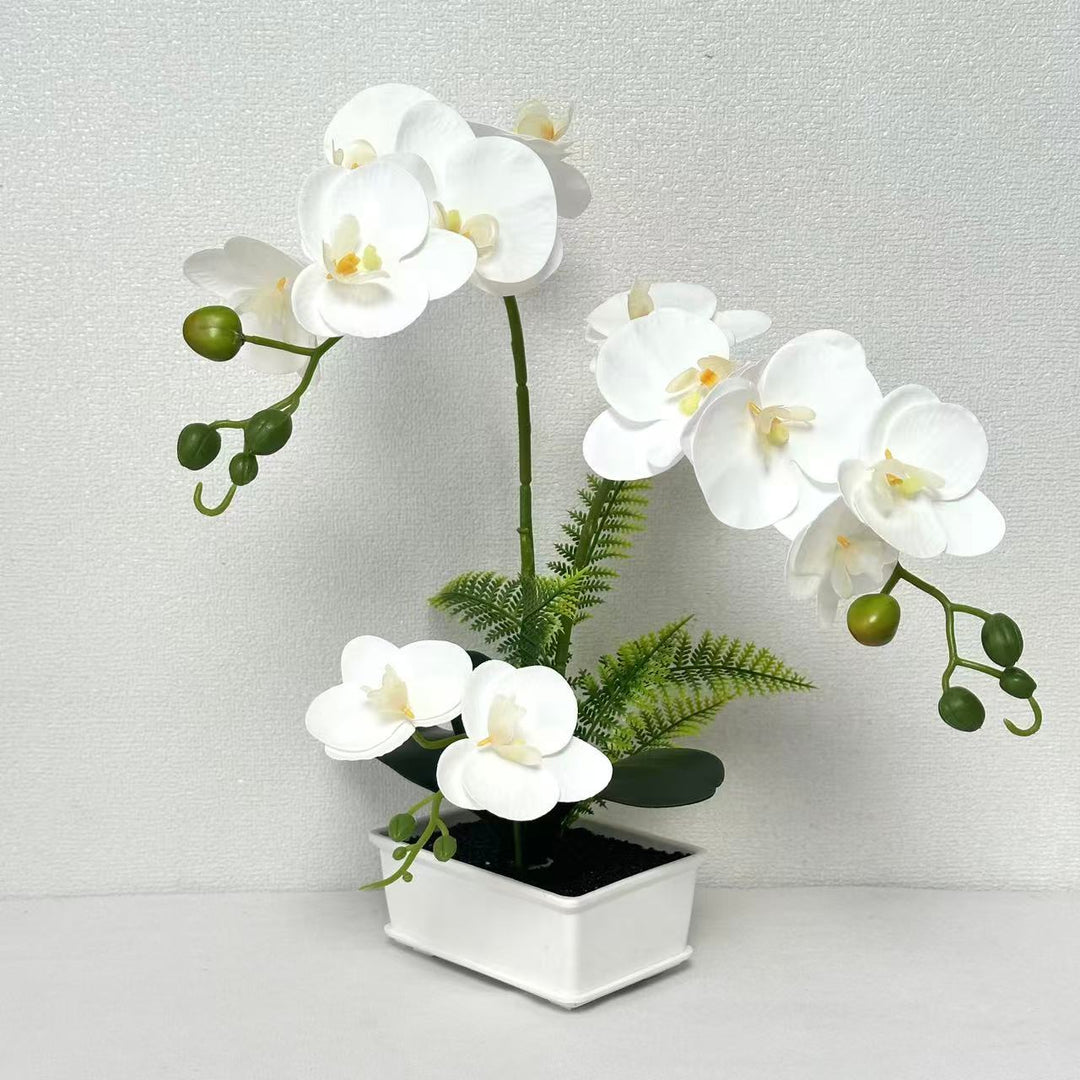 Elegante künstliche Orchideenarrangement für die Innendekoration