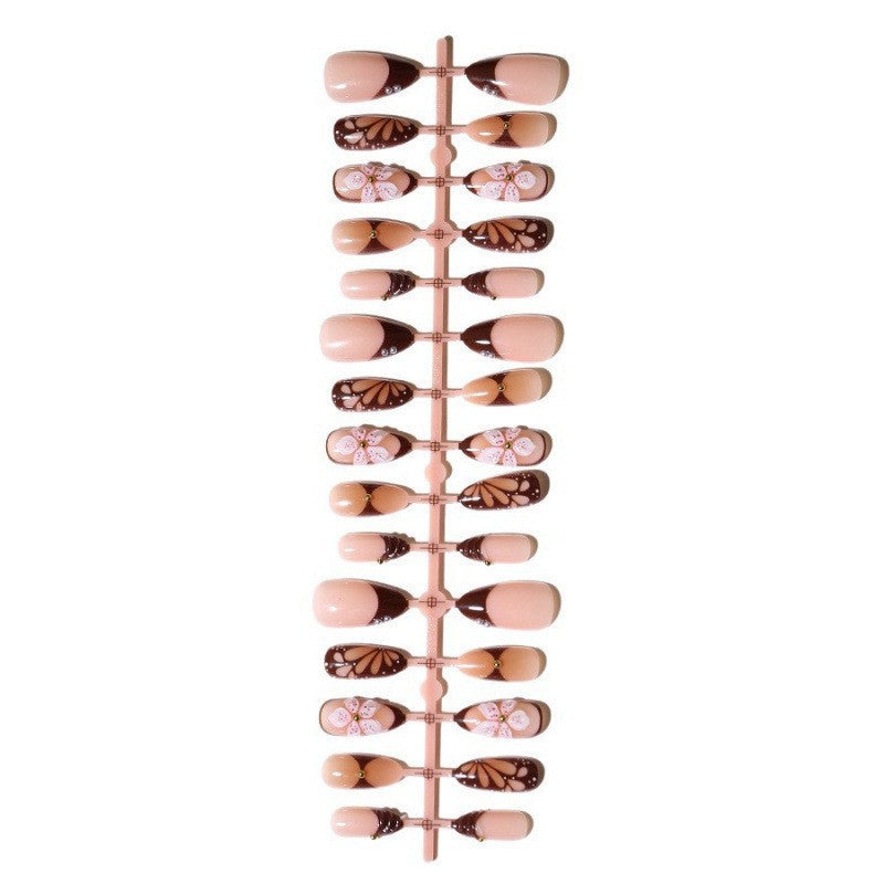 Kunstnagelset mit exquisiten floralen Motiven Karnz