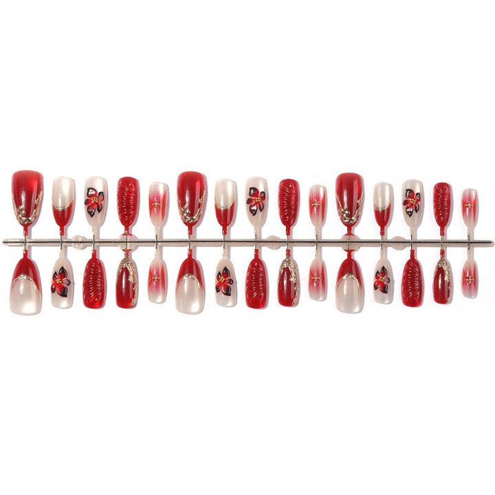 Kunstnagelset mit floralem Design und eleganten Glitzerdetails Karnz