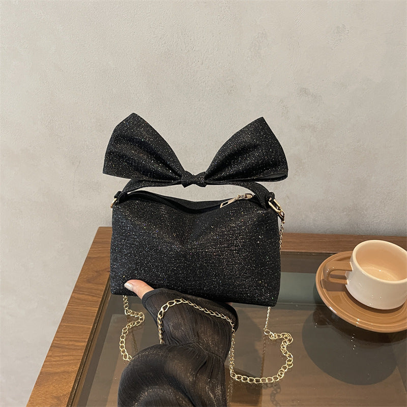 Bogen-accentuierte funkelnde Handtasche