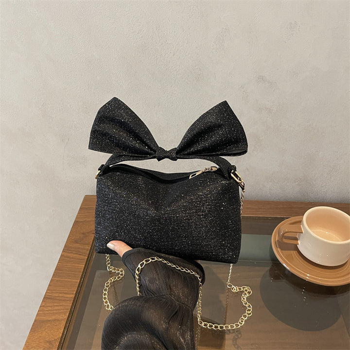 Bogen-accentuierte funkelnde Handtasche