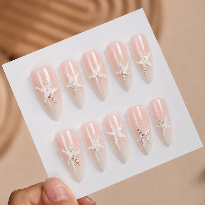 Kunstnagelset mit eleganten Stern-Motiven Karnz