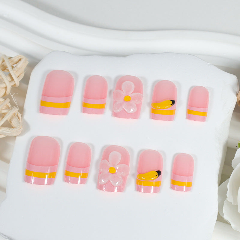 Kunstnagelset mit verspielten Blumen- und Fruchtmotiven Karnz