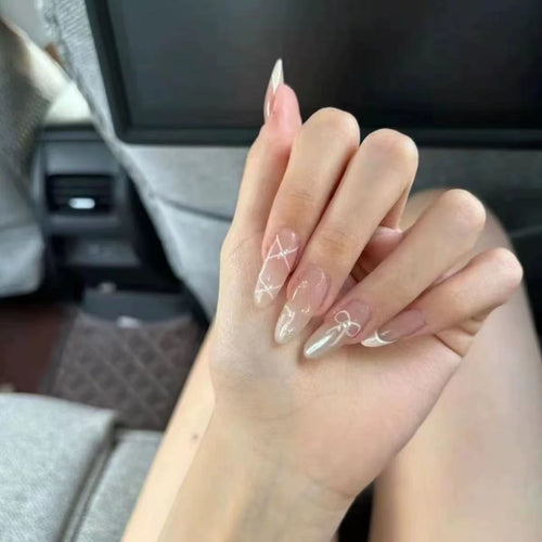 Künstlerisches Press-On-Nagelset mit Schleife und geometrischem Design